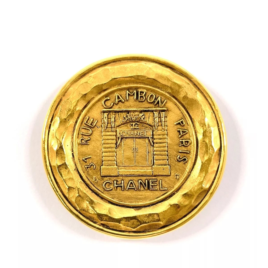 Chanel Gold Brooch With Intricate Design And Textured Finish